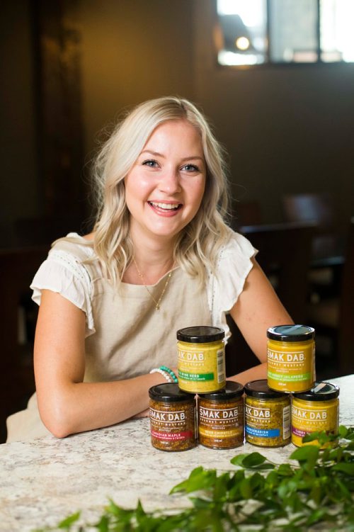 MIKAELA MACKENZIE / WINNIPEG FREE PRESS
Carly Minish, owner of Smak Dab mustard, poses for a portrait in Winnipeg on Friday, July 27, 2018. 
Winnipeg Free Press 2018.