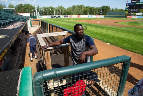 ANDREW RYAN / WINNIPEG FREE PRESS Winnipeg Goldeyes Reggie Abercrombie (11) stands in the dug out after batting practice was cancelled due to rain at Shark Park on July 27, 2018.
