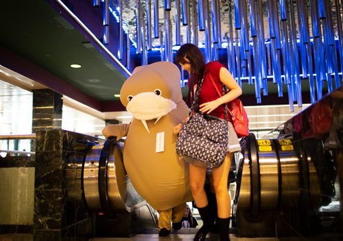 ANDREW RYAN / WINNIPEG FREE PRESS Madeline Carlson helps friend Angel Holey, who is dressed as a Walrus, up the escalator during Ai-Kon at the RBC Convention Centre on July 28, 2018.