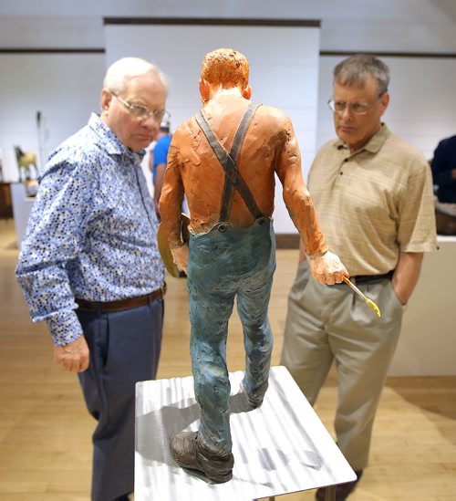 JASON HALSTEAD / WINNIPEG FREE PRESS

L-R: Attendees Ted Ransby and Larry de March check out Joe Fafards bronze sculpture of Vincent Van Gogh, entitled The Sower, which depicts the Dutch master at work, at the opening of the Essential Joe Fafard  Van Gogh and Other Inspirations exhibition on July 6, 2018, at Mayberry Fine Art in the Exchange District. (See Social Page)