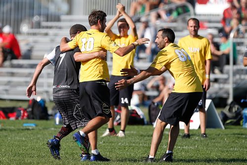 JOHN WOODS / WINNIPEG FREE PRESS
Julien Gréau (10) from France's team Sun (yellow) is helped off the field by Martin Bérubé (7) of Quebec's team Quantum (black) in the 2018 World Masters Ultimate Championship at Little Mountain Sportsplex in Winnipeg Sunday, July 29, 2018. The tournament has 1700 athletes from around the world and runs all week.