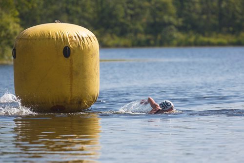 MIKE DEAL / WINNIPEG FREE PRESS
Chantel Jeffrey completes the first lap of the 2018 Canadian Junior Swimming Championships Open Water women 15-17 finals at St. Malo Provincial Park Monday morning.
180730 - Monday, July 30, 2018.

