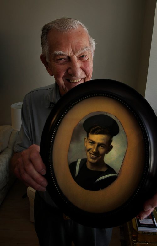 PHIL HOSSACK / WINNIPEG FREE PRESS -93yr old WW2 Navy veteran Robert Watkins shows off a color portrait of himself as aveteran seaman just returned from WW2. See Ben Waldman's story. - July 31, 2018