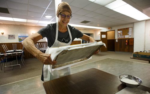 MIKE DEAL / WINNIPEG FREE PRESS
Alenia Howell flips the sponge for the lemon torte in the basement of the Our Lady of Lourdes church at 95 MacDonald Ave. where volunteers are baking huge lemon tortes for the Slovenian pavilion which makes all their own food for Folklorama.
180721 - Saturday, July 21, 2018.