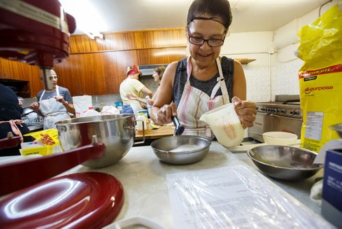 MIKE DEAL / WINNIPEG FREE PRESS
Hilda Terry mixing honey biscuit dough for the lemon torte in the basement of the Our Lady of Lourdes church at 95 MacDonald Ave. where volunteers are baking huge lemon tortes for the Slovenian pavilion which makes all their own food for Folklorama.
180721 - Saturday, July 21, 2018.