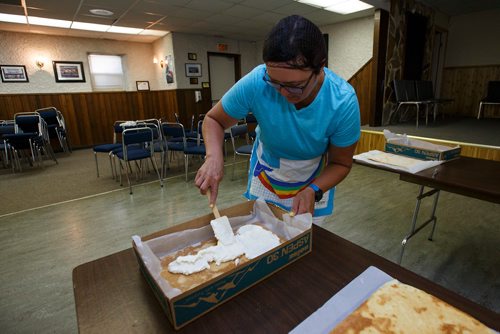 MIKE DEAL / WINNIPEG FREE PRESS
Pauline Tutkaluke adds cream filling for the lemon torte in the basement of the Our Lady of Lourdes church at 95 MacDonald Ave. where volunteers are baking huge lemon tortes for the Slovenian pavilion which makes all their own food for Folklorama.180721 - Saturday, July 21, 2018.