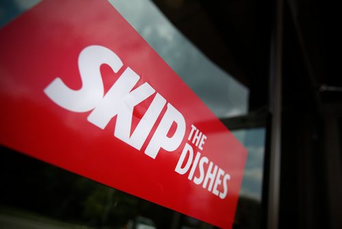 JOHN WOODS / WINNIPEG FREE PRESS
Signs of Skip The Dishes, the food delivery service, stick to restaurant windows in Winnipeg Monday, July 30, 2018. The service provided is having labour issues.