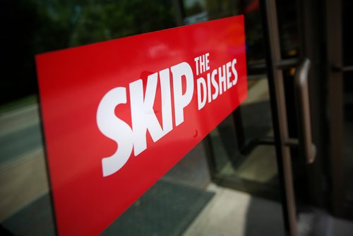 JOHN WOODS / WINNIPEG FREE PRESS
Signs of Skip The Dishes, the food delivery service, stick to restaurant windows in Winnipeg Monday, July 30, 2018. The service provided is having labour issues.