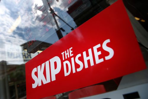 JOHN WOODS / WINNIPEG FREE PRESS
Signs of Skip The Dishes, the food delivery service, stick to restaurant windows in Winnipeg Monday, July 30, 2018. The service provided is having labour issues.