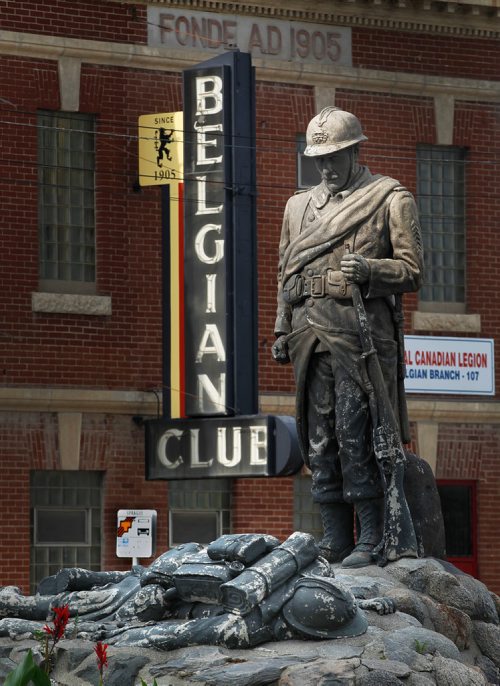 PHIL HOSSACK / WINNIPEG FREE PRESS - A statue of a Belgian Soldier stands over a fallen comrad in front of the Belgian Club on Provencier ave Monday. See story. - July 30, 2018