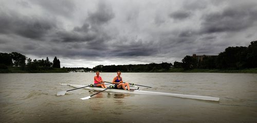 PHIL HOSSACK / WINNIPEG FREE PRESS - Training on the Red River sisters Casie MacCharles (pink) and Kaelyn Gauthier (blue) are venturing into "Coastal Rowing" competition. See Taylor Allen's story. - July 31, 2018