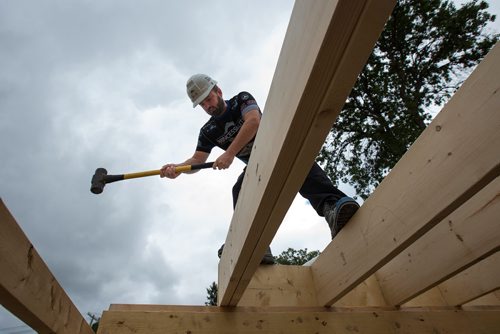 MIKE DEAL / WINNIPEG FREE PRESS
Reid Carruthers, the skip for Team Carruthers volunteers his time to Habitat for Humanity at a triplex build on Enfield Crescent in St. Boniface Wednesday morning.
180801 - Wednesday, August 01, 2018.