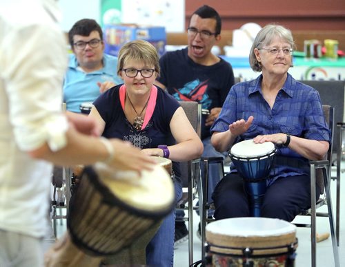 JASON HALSTEAD / WINNIPEG FREE PRESS

L-R: Ashley Donald and Laura Schnellert take part in the drum session at Inclusion Winnipeg's 60th anniversary community barbecue and drumming session at Westminster United Church on July 19, 2018. (See Social Page)