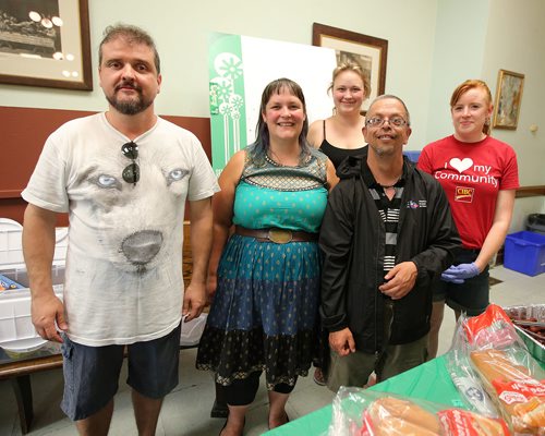 JASON HALSTEAD / WINNIPEG FREE PRESS

L-R: Volunteer Milton Almeida, Tania Douglas (Inclusion Winnipeg's director of development), Olivia Brown (Inclusion Winnipeg's administrative assistant), volunteer Kevin Johnson and Erin Dupuis (CIBC Commercial Banking) prepare to serve up food at Inclusion Winnipeg's 60th anniversary community barbecue and drumming session at Westminster United Church on July 19, 2018. (See Social Page)