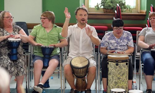 JASON HALSTEAD / WINNIPEG FREE PRESS

Facilitator Chris Scholl (middle) of DNA Rhythms leads the drumming at Inclusion Winnipeg's 60th anniversary community barbecue and drumming session at Westminster United Church on July 19, 2018. (See Social Page)