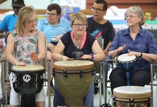 JASON HALSTEAD / WINNIPEG FREE PRESS

L-R: Milli Flaig-Hooper, Ashley Donald and Laura Schnellert take part in the drum session at Inclusion Winnipeg's 60th anniversary community barbecue and drumming session at Westminster United Church on July 19, 2018. (See Social Page)
