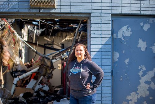 MIKAELA MACKENZIE / WINNIPEG FREE PRESS
Nicole Woelke, president of the board, poses by the fire-damaged Assiniboia West Recreation Centre in Winnipeg on Thursday, Aug. 2, 2018. 
Winnipeg Free Press 2018.