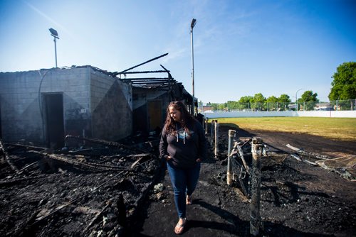 MIKAELA MACKENZIE / WINNIPEG FREE PRESS
Nicole Woelke, president of the board, takes a look at the fire-damaged Assiniboia West Recreation Centre in Winnipeg on Thursday, Aug. 2, 2018. 
Winnipeg Free Press 2018.