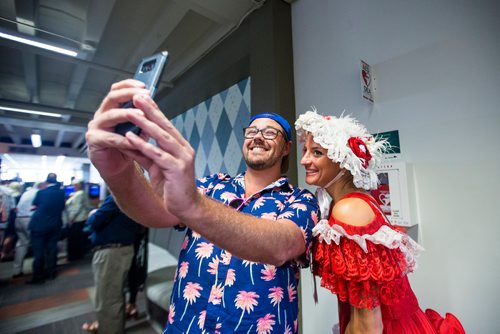 MIKAELA MACKENZIE / WINNIPEG FREE PRESS
AJ Leite takes a selfie with Francine Fournier, this year's derby belle, at the Manitoba Derby draw lunch at the Assiniboia Downs in Winnipeg on Thursday, Aug. 2, 2018. 
Winnipeg Free Press 2018.
