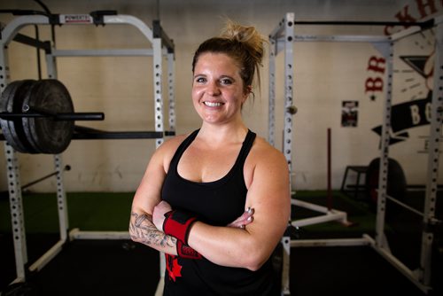 ANDREW RYAN / WINNIPEG FREE PRESS Megan Swidnicki poses for a portrait at Brickhouse Gym and is set to compete in her first strongman competition at being this weekend held at the same facility. Shot on August 2, 2018.