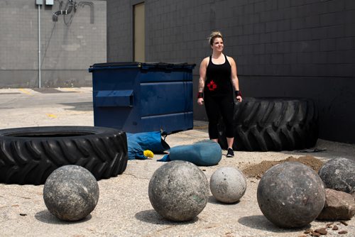 ANDREW RYAN / WINNIPEG FREE PRESS Megan Swidnicki poses for a portrait behind Brickhouse Gym and is set to compete in her first strongman competition at being this weekend held at the same facility. Shot on August 2, 2018.