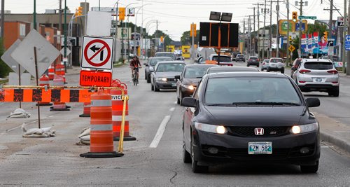 PHIL HOSSACK / WINNIPEG FREE PRESS -  Northbound traffic switches to the southbound lanes at logan leading to the McPhillips Street underpass Thursday. See story.  - August 2, 2018