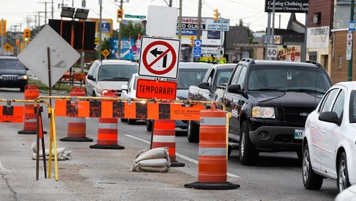 PHIL HOSSACK / WINNIPEG FREE PRESS -  Northbound traffic switches to the southbound lanes at logan leading to the McPhillips Street underpass Thursday. See story.  - August 2, 2018