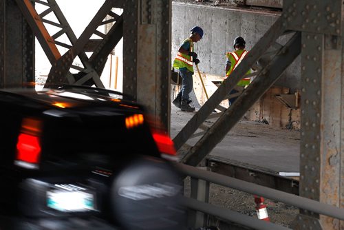 PHIL HOSSACK / WINNIPEG FREE PRESS -  Workers under the McPhillips Street underpass Thursday. See story.  - August 2, 2018