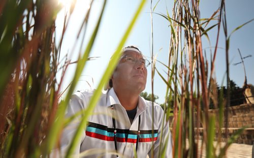 RUTH BONNEVILLE / WINNIPEG FREE PRESS

Portrait of Sgt. Kevin Redsky, founder of Hope in the Darkness Walk, next to the tall sweet grass in the Oodena Celebration Circle at The Forks Friday.  

Photo was taken after the press conference announcing the near completion of the walk across Canada by Redsky and other members of the police force, healthcare providers and supporters to raise awareness for young people facing mental health issues, Friday.  

See Ashely Prest story.  


August 3rd,, 2018
