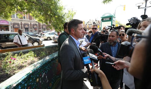 RUTH BONNEVILLE / WINNIPEG FREE PRESS


Mayor Brian Bowman talks to the media in a scrum after presser was held at northeast corner of Osborne St and River about plans by the mayor along with representatives of key community organizations, to address and reduce the occurrence of unsafe panhandling Friday afternoon.  



August 3rd,, 2018
