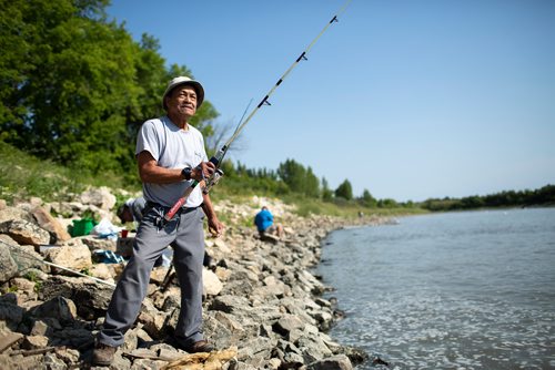 ANDREW RYAN / WINNIPEG FREE PRESS Angler, Romualdo Sison fishes along the Red River just down stream from the Lockport Dam on August 3, 2018. Judy Robertson, past president of the Wildlife Haven Rehabilitation centre, advocated for monofilament (fishing line) recycling boxes at the Lockport Lock and Dam after seeing the same program in Florida.