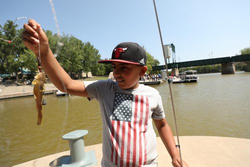 RUTH BONNEVILLE / WINNIPEG FREE PRESS


Ishaan Chahal (9yrs) catches a little cat fish which he quickly releases while fishing off the pier with his mom (not in photos) at the Forks Friday afternoon.  

Standup photo 

August 3rd,, 2018
