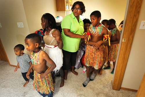 PHIL HOSSACK / WINNIPEG FREE PRESS -  Florence Okwudili ushers members of the Umunna Igbo Association Dancers into a small room in her basement to rehearse for their Folklorama apperances. . See Melissa Martin's story.  - August 3, 2018