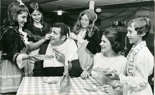 WINNIPEG FREE PRESS FILES
Image published Aug. 17, 1971. Caption published with image: Honorary Greek consul Michael Mercury gets the royal treatment during Folklorama 71 celebrations Monday at the Greek pavilion. Surrounding Mr. Mercury (left to right) are Anita Vandalos, Mary Tsouras, Georgia Carabelas, Mary Kelekis and Athena Anadranistakis. They are dressed in Greek costumes of 1800.