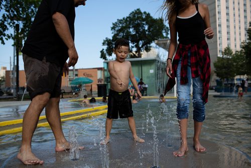 ANDREW RYAN / WINNIPEG FREE PRESS Xavier Henry, 4, enjoys the splash pad in Central Park on August 4, 2018. He was there with his father Edward Markham and sister Mya Green, 11.
