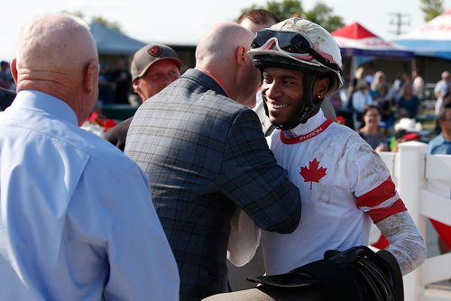 JOHN WOODS / WINNIPEG FREE PRESS
Rico Walcott is congratulated after riding Sky Promise to a win in the 70th running of the Manitoba Derby at Assiniboia Downs Monday, August 6, 2018.