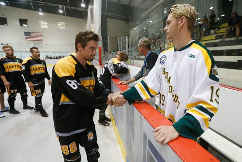 JOHN WOODS / WINNIPEG FREE PRESS
Manitoba Selects players greet Bonnie and Kelly Schatz, parents of Logan Schatz, who was killed in the Humboldt Broncos crash, and crash survivor Mathieu Gomeric at the opening of the Canadian Ball Hockey Association Nationals at MTS Iceplex Monday, August 6, 2018.