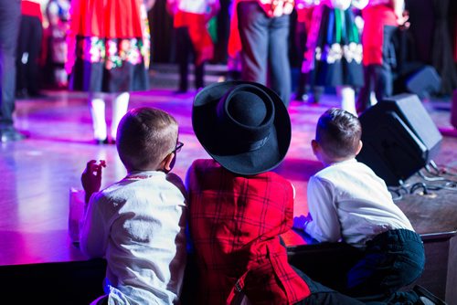 MIKAELA MACKENZIE / WINNIPEG FREE PRESS
Three smaller boys watch as dancers perform at the Casa do Minho Portuguese Pavilion in Winnipeg on Monday, Aug. 6, 2018. 
Winnipeg Free Press 2018.