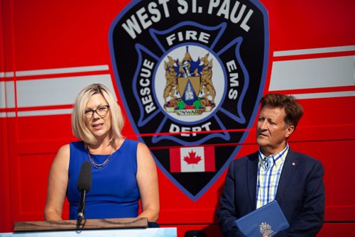 ANDREW RYAN / WINNIPEG FREE PRESS Sustainable Development Minister Rochelle Squires speaks at a press event, with Infrastructure minister Ron Schuler behind her, announcing new public safety communications devices at the West St. Paul Fire Hall on August 8, 2018.
