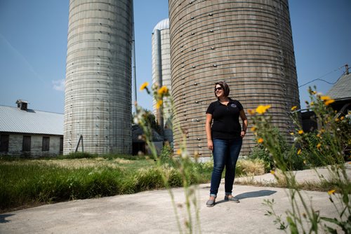 ANDREW RYAN / WINNIPEG FREE PRESS Zoé Nakata, the executive director of the Wildlife Haven and Rehabilitation Centre, poses for a portrait in front of the silos at the centre's current location, a repurposed dairy farm. The rehabilitation centre is soon moving into a brand new $3 million facility boasting an interactive visitor centre, animal viewing area, and many other improvements over their current location south of Winnipeg. Shot on August 8, 2018.