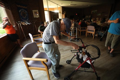 RUTH BONNEVILLE / WINNIPEG FREE PRESS


Residents at St Josaphat Selo-Villa  low-income housing at 114 McGregor St. bear the heat and darkness after power has been out in their block since Monday evening. 

Bienvenido Nicdao, an older resident who uses a walker goes to sit down in the darkened dining hall to have his dinner of a subway sandwich and pop as he deals with the warm temperatures in his block along with the others during a power outage Wednesday.  

See Erik's story.  

August 8th, 2018