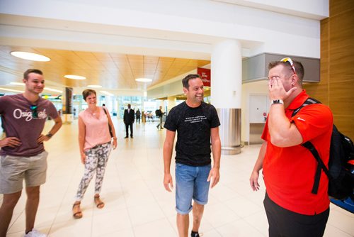MIKAELA MACKENZIE / WINNIPEG FREE PRESS
Jamie Benzelock (right) meets his stem cell donor, Marco Kiunka, for the first time as Marco's wife and son, Nicole and Noah, watch at the airport in Winnipeg on Thursday, Aug. 9, 2018. 
Winnipeg Free Press 2018.
