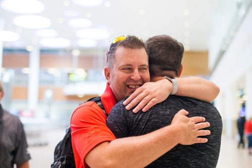 MIKAELA MACKENZIE / WINNIPEG FREE PRESS
Jamie Benzelock meets his stem cell donor, Marco Kiunka, for the first time at the airport in Winnipeg on Thursday, Aug. 9, 2018. 
Winnipeg Free Press 2018.