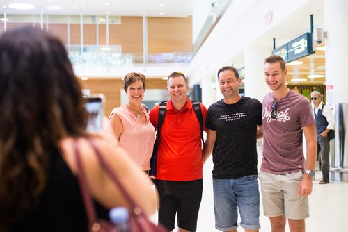 MIKAELA MACKENZIE / WINNIPEG FREE PRESS
Nicole Kiunka, Jamie Benzelock, Marco Kiunka, and Noah Kiunka pose for a photo together for the first time at the airport in Winnipeg on Thursday, Aug. 9, 2018. More than friends, they consider each other family now.
Winnipeg Free Press 2018.