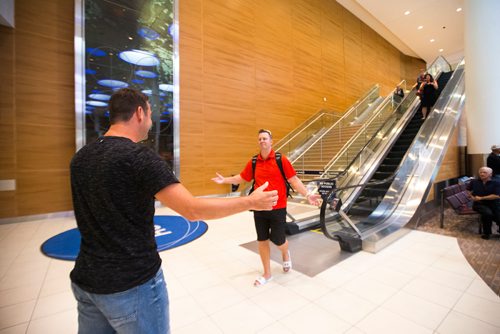 MIKAELA MACKENZIE / WINNIPEG FREE PRESS
Jamie Benzelock (right) meets his stem cell donor, Marco Kiunka, for the first time at the airport in Winnipeg on Thursday, Aug. 9, 2018. 
Winnipeg Free Press 2018.