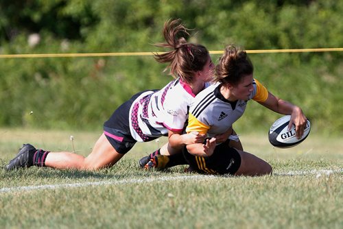 JOHN WOODS / WINNIPEG FREE PRESS
Manitoba's Sierra Winogradoff (7) scores the try against Alberta's Melina Ioannides (9) at the Western Canada U18 Rugby Championships at Maple Grove Rugby Park in Winnipeg Thursday, August 9, 2018. The tournament runs Aug 9-12.