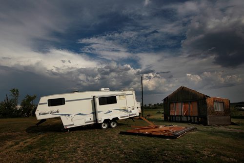 PHIL HOSSACK / WINNIPEG FREE PRESS -   A camper blown off its level mooring sits beside the remains of another cottage at the Margaret Bruce Beach and campground Tuesday. A tornado ripped through the Alonsa Manitoba area Friday. See story. - August 7, 2018