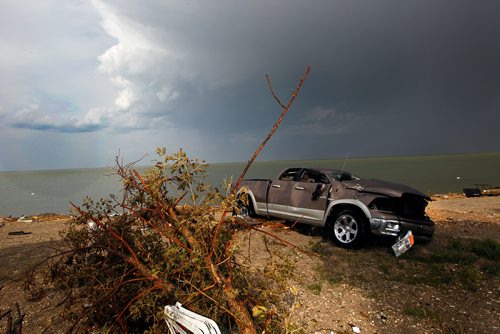 PHIL HOSSACK / WINNIPEG FREE PRESS - Dragged out of Lake Manitoba after Friday's tornado, a wrecked pick up truck that once pulled the family camper waits for further salvage at Margaret Bruce Beach.  See story. - August 7, 2018