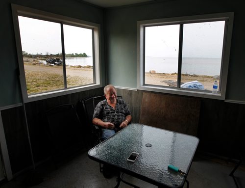 PHIL HOSSACK / WINNIPEG FREE PRESS -  Sitting in the Margaret Bruce Beach office and campground store with the wreckage of a camper over his right shoulder Tuesday, Jimmy Bruce laughs at himself in hindsight for staying in the structure as a tornado destroyed the family campground Friday. See story. - August 7, 2018
