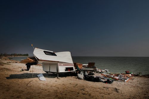 PHIL HOSSACK / WINNIPEG FREE PRESS -  Pulled from the water, a trailer sits on shore surrounded by it's spilled contents at Margaret Bruce Beach on Lake Manitoba Wednesday.  See story. - August 8, 2018